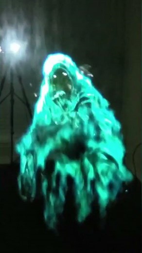 Halloween Decoration Ghost Projected Onto Vapor From A fog Machine