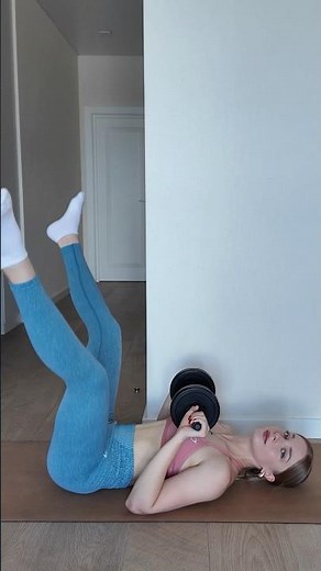 Leg scissors + dumbbell crunch (lying on back)