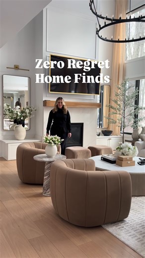 Monika Saran on Instagram: "Comment HOME below for my zero regret finds including my brown velvet swivel accent chairs, marble side table, designer look counter stools, 8 foot fluffy faux tree in pot, neutral wall art and linen accent chairs."