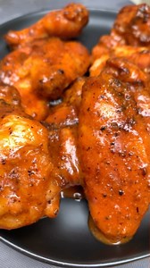Brian Gerwig on Instagram: "Classic Buffalo Wings! Full instructions below Recipes ⤵️ Rub: * Salt, pepper, garlic * Your favorite BBQ rub (I used @rainierfoods Omega) Sauce: * 1/2 stick of butter * 1cup hot sauce Cooking instructions: 1. Place wings on wire rack in fridge for 3 hours (this helps dry the skin out, which makes for a crispier wing) 2. Season your wings with olive oil and wing rub above 3. Cook your wings (350° for about 50 minutes until an IT of 190°) 4. To make the sauce, add all 