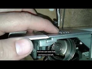 How to adjust the feed dogs on a Singer sewing machine