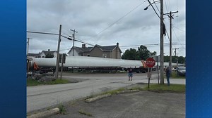 Wind turbine blade on truck heading to Iowa hits building near sharp curve in Westmoreland County