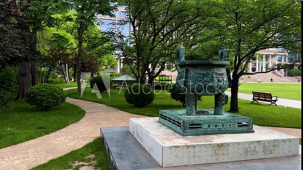 Memorial bronze tripod, donated by alumni association in 2005 to celebrate 100th anniversary of University on Handan Campus of Fudan University, Shanghai, China. Stock Video