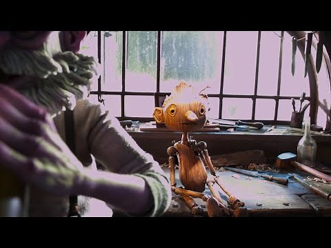 Geppetto bringing Pinocchio to life scene from Guillermo del Toro's Pinocchio 2022.