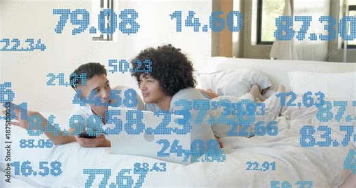 Two men on bed sharing phone, sparking data, typing laptop with blue numbers overlaying