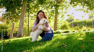 Young Woman Gives White Fluffy Dog a Big Hug Stock Video