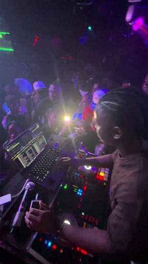 Exciting Nightclub DJ Performance with Lively Crowd