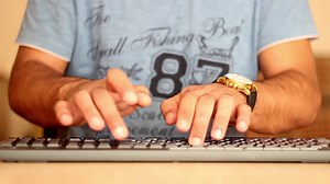 Download Hands typing on the computer keyboard, timelapse, selective focus for free