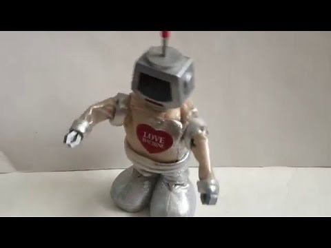 PlayMotions Awesome Animatronics! Love Machine Animated Singing & Dancing Robot Valentine's Day