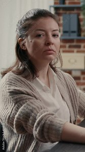 Vertical video Software engineer typing source code on computer keyboard turning head and smiling at camera. Casual database admin computing big data in it startup company feeling confident.