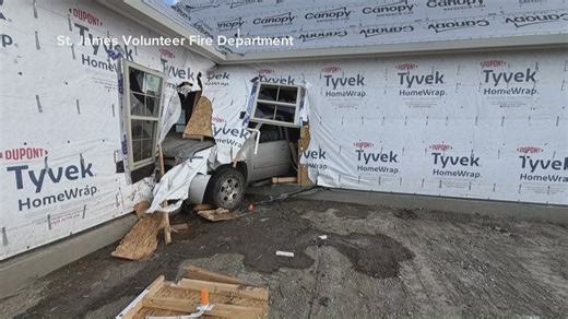 Truck crashes into house