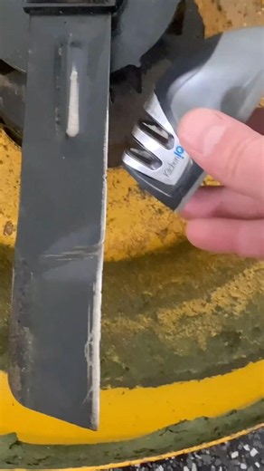 Using a knife sharpener to sharpen a lawn mower blade