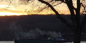 Barge stuck on sandbar in Thames River