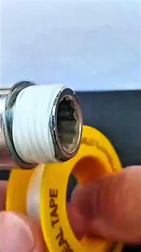 wrapping teflon tape around threaded metal pipe fitting