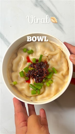This viral steamed dumpling bowl might just be a tiny stroke of genius. It gives homemade dumpling vibes without the wrapping marathon. Will I choose it over my classic, perfectly wrapped dumplings? Maybe not. But for tired, post-work evenings when comfort is non-negotiable — this hits different. Would you give it a shot? Ingredients Minced meat Minced ginger Spring onions Sesame oil Soy sauce Oyster sauce Refined flour Water Salt Toppings Spring onions & chilli oil Save this for your laziest, h