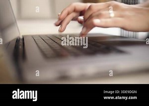 Person typing on laptop keyboard at home Stock Video Footage - Alamy