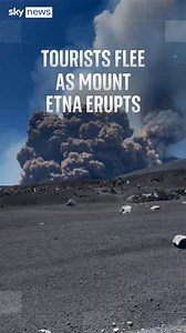 Tourists were seen fleeing from Mount Etna after an eruption sent huge clouds of smoke and ash into the sky. Italy's National Institute of Geophysics and Vulcanology said explosive activity from the Southeast Crater ‘has moved to a lava fountain’. | Sky News