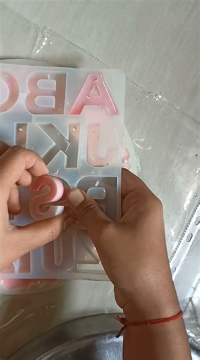 “Wait for it 😍 The Most Satisfying Resin Keychain Unmoulding ✨ | DIY Alphabet Keychain | #shorts.”