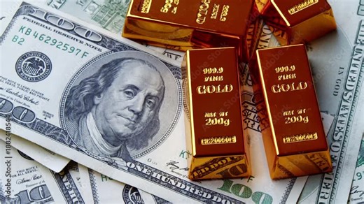 Gold And Cash Reserves Concept Featuring Shining Gold Bars And US Dollar Bills. Financial Stability Investment Strategy And Wealth Preservation Symbol.Precious Gold Bars Lying On US Dollar Banknotes