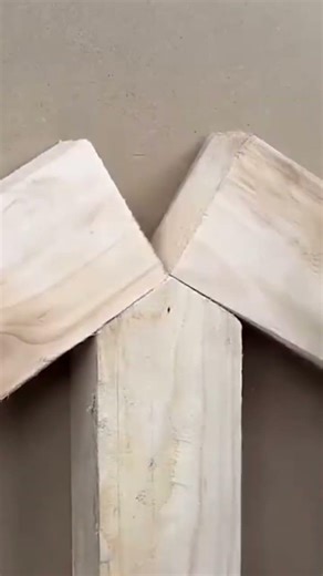 A piece of wood is being measured using a ruler and marked using a pen.