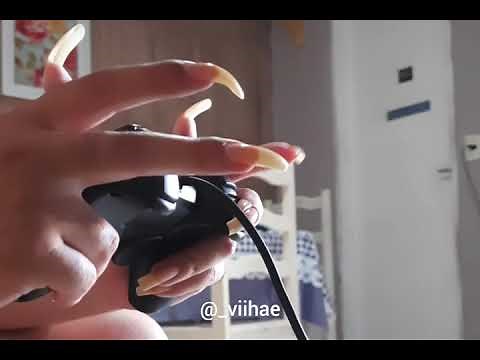 Playing video game with long nails