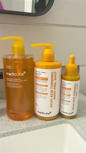 I have to put you guys on because this Medicube Trio on TikTok Shop is actually a MEGA deal right now ✨ Face Peel Shot ✨ Body Peel Shot ✨ Brightening Body Wash If your skin has been dull, textured, uneven, breaking out, or just looking tired this trio is that “start fresh” moment. The Brightening Complex alone?? Kojic Acid Turmeric Vitamin C Niacinamide. That combo is MADE to help even tone, brighten, and bring life back to your skin. And then the multi-acid exfoliation? BHA, LHA, and PHA workin