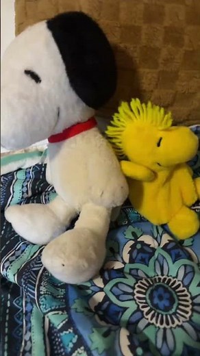 Snoopy and Woodstock are dancing together