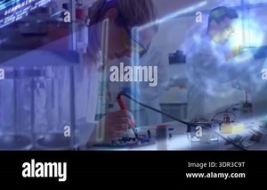 Early-career engineer assembling circuit with soldering iron analyzing data using animated overlays. Innovation, technology, collaboration, precision, analytics, engineering, futurism Stock Video Footage - Alamy