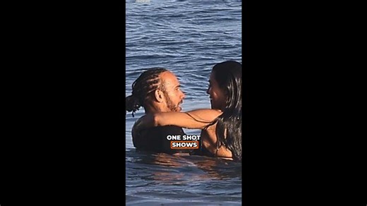Lewis gets handsy with Kim during beach outing