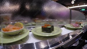 4k, Sushi on conveyor belt in Japan Restaurant, Traditional Japanese food in a restaurant conveyed on a moving belt, Shushi Go Round is a form fast-food common in Asia, also known as sushi train -Dan