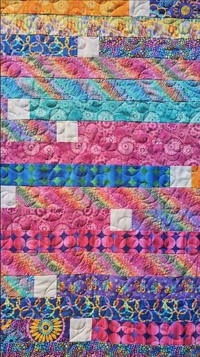 A super quick quilt. Fast Piecing, fast meander quilting. Fun Bright Fabric. Jelly Roll Race Pattern