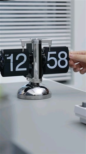 Asian Technology on Instagram: "Experience the charm of a physical timepiece with a rotating number plate! This unique device displays the time by mechanically swiping each number into place every second. A perfect blend of vintage aesthetics and modern functionality, it’s an eye-catching addition to any space. Watch time come alive with this mesmerizing, precision-crafted timepiece!"