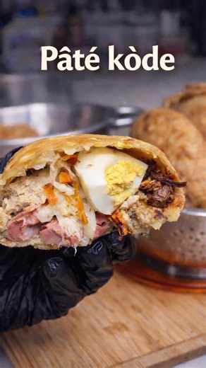 Neyoo on Instagram: "Haitian Paté Kodé, Combo Fried Patty Crispy Haitian fried patty stuffed with chicken, smoked herring, hot dog, egg, cheese, and pikliz. Ingredients Dough 4 cups all purpose flour 1 1/2 cups warm water 1 tsp salt 1 Maggi cube, crushed, or 1 to 2 tsp Maggi seasoning 1/3 cup vegetable oil Oil for frying Filling 6 to 8 chicken drumsticks 2 tbsp Haitian epis 1 tsp salt 1/2 tsp black pepper 1/2 tsp paprika 1 sprig thyme 1 cup water, for stewing 6 hard boiled eggs, sliced 1 cup smo