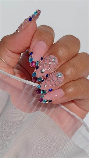 9.2K views · 194 reactions | Nail Tutorial: The easiest way to apply nail crystals & charms! Comment “MERMAIDCORE” for everything you need to recreate this look ✨隆‍♀️ Save & share for inspo! IB: @julietavenegas_nails #mermaidcorenails #mermaidnails #diynails #summernails #howtonails #3dnails #nails #nailcharms #nailcrystals #nailtutorial #nailart #nailinspo #nailhack #summernails2024 #mermaidcore | Daily Charme | Facebook
