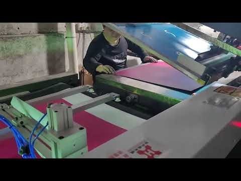 automatic unloading arm for pick off material after printed