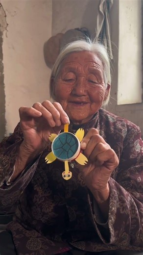 Here, I'll give you a little moving turtle to play with. #Grandma #RuralLife