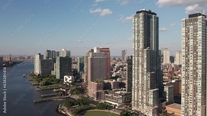 Luxury high-rises in New York's LIC neighborhood, 4K aerial.