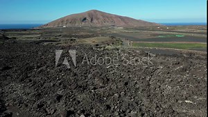Drone aerial view of Volcán de La Corona is a 609 meters high extinct volcano on the Canary Island of Lanzarote, close to Yé and Haría in Canaries island , Spain - crater volcano view