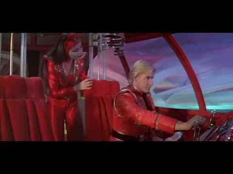 Princess Aura teaches Flash Gordon how to pilot a spaceship