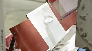 Manufacturing Bottle Caps, Dropping Off A Cap Lining Machine