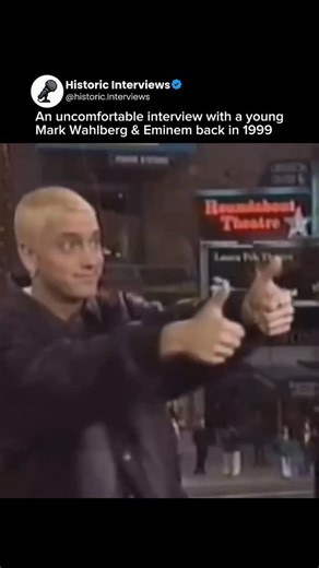 Historic Interviews 🎤 on Instagram: "Back in 1999, Mark Wahlberg and Eminem were put together for a joint interview that never found its rhythm. The energy was off from the start — Mark keeping things guarded and serious, Eminem leaning into sarcasm and pushing at the edges. Every exchange felt slightly sideways, like they were speaking two different languages in the same room. The awkwardness built fast. Small comments landed wrong, timing didn’t match, and the tension never eased. It wasn’t e