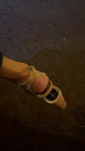 Fashion Focus: High-Heeled Shoe on Asphalt Surface