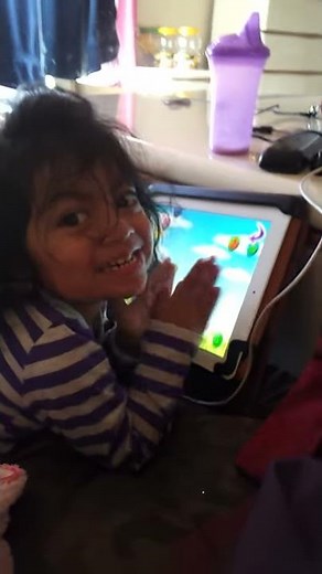 Toddler playing IPAD ABC Song