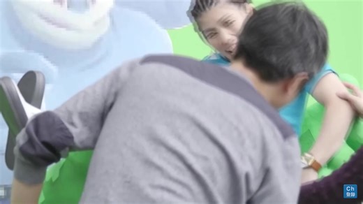 Playful Moments at Amusement Park with Cartoon Inflatable