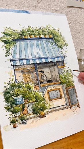 Drawings by JilLee on Instagram: "Cafe sketching with Ink and watercolor ☕️ Watch the tutorial for this on YouTube now! Link in stories and bio🖊 . #artreel #artreels #artreelsofinstagram #wipartwork #artprocessvideo #worldwatercolorgroup #artchallenge2022 #artistssupportingartists #watercolorart #watercolorillustration #watercolor #watercolorsketch #watercolourdrawing #watercolourblog #watercolour_daily #watercolour_illustration #aquarelle #aquarelleart #arttutorial #urbanscapeschallenge #sketc