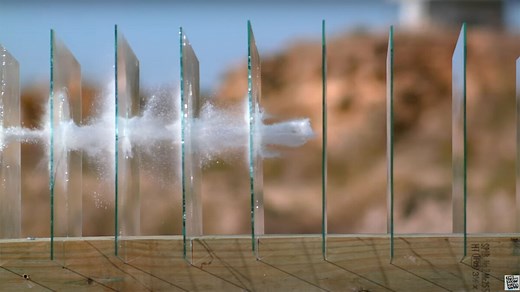 Watch a bullet travelling through multiple glass panes in extreme slow motion