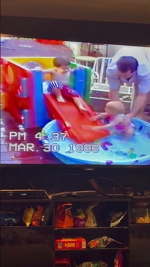 Slide into Barney pool 1996. Baby Auatin and Heather