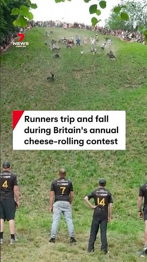 Runners fall down Cooper's Hill in Gloucestershire, England for annual cheese rolling contest