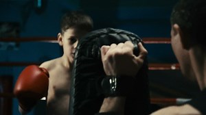 A little kid training boxing on the ring - Free Stock Video