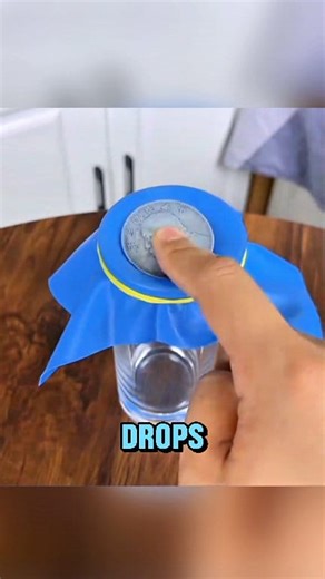 311K views · 1.3K reactions | Ever seen a coin pass straight through plastic? This simple yet mind-blowing trick shows how it’s actually done. All you need is a coin, some stretchable plastic, and a glass — and a bit of illusion magic #magictrick #illusion #shorts #cointrick #howitworks #satisfying #science | Tech Today | Facebook